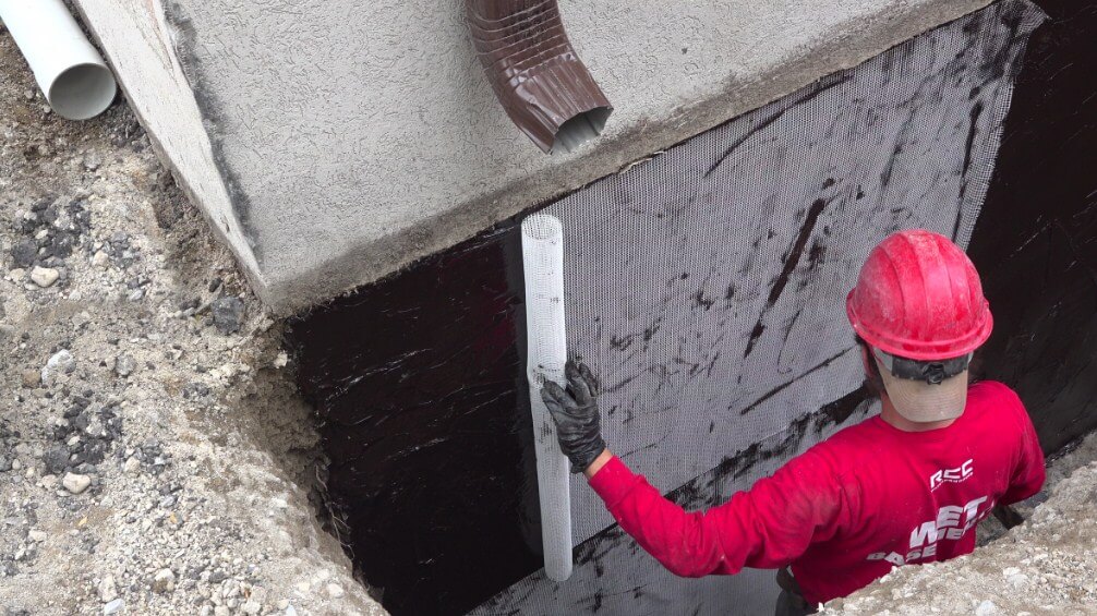 team performing exterior foundation waterproofing